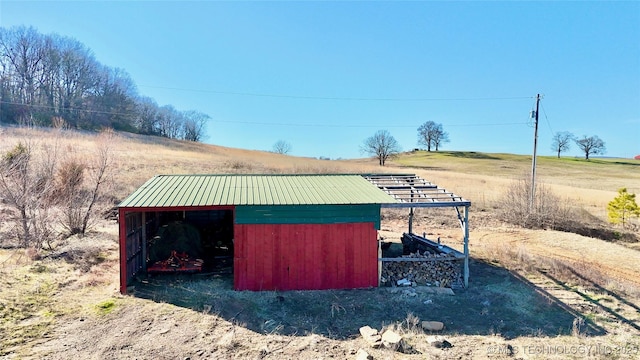 view of outbuilding featuring a rural view