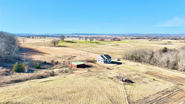 birds eye view of property featuring a rural view