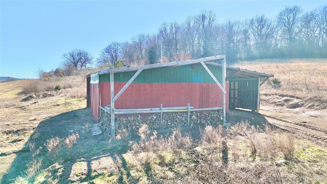 view of outbuilding featuring a rural view