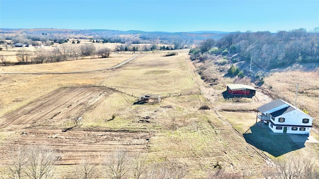 drone / aerial view featuring a mountain view and a rural view