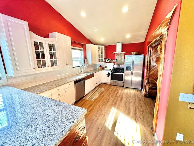 610 SW 7th Rd, Stigler, OK 74462 - kitchen featuring tasteful backsplash, appliances with stainless steel finishes, lofted ceiling, a sink, and ventilation hood