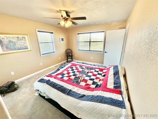 610 SW 7th Rd, Stigler, OK 74462 - bedroom featuring carpet floors, baseboards, a textured wall, and a textured ceiling