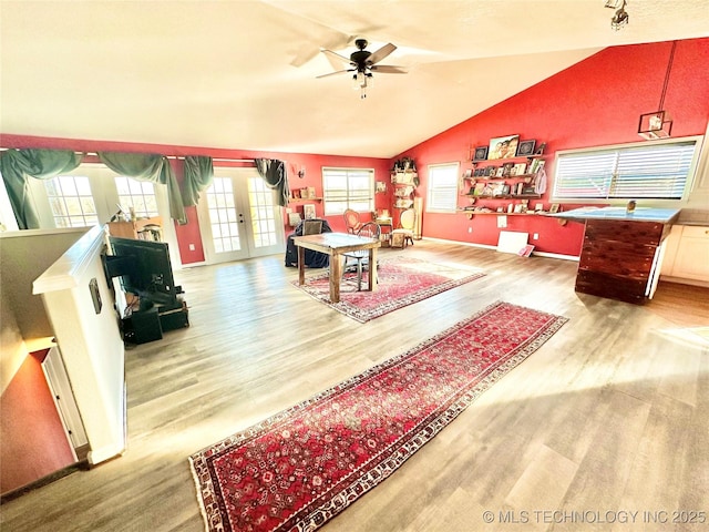 610 SW 7th Rd, Stigler, OK 74462 - interior space featuring lofted ceiling, baseboards, a ceiling fan, and wood finished floors