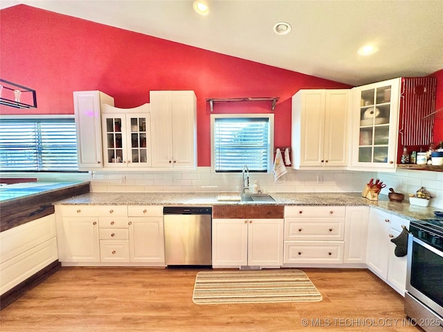 kitchen featuring sink, stainless steel appliances, and white cabinets