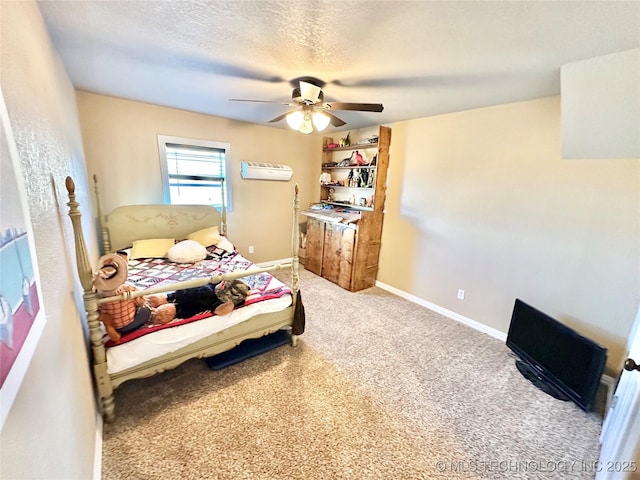 carpeted bedroom featuring ceiling fan and a textured ceiling