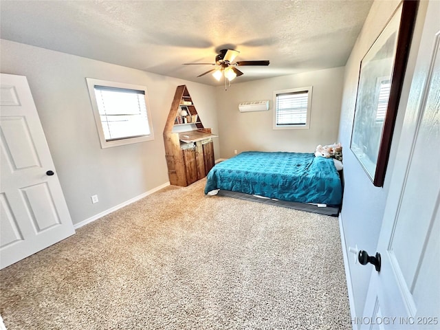 610 SW 7th Rd, Stigler, OK 74462 - carpeted bedroom with baseboards, ceiling fan, and a textured ceiling