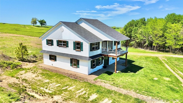 610 SW 7th Rd, Stigler, OK 74462 - view of side of property featuring a shingled roof, a wooden deck, and a lawn