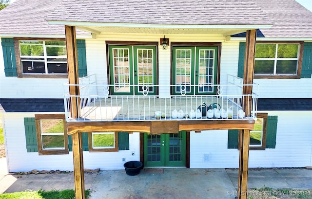 610 SW 7th Rd, Stigler, OK 74462 - back of property with roof with shingles and french doors