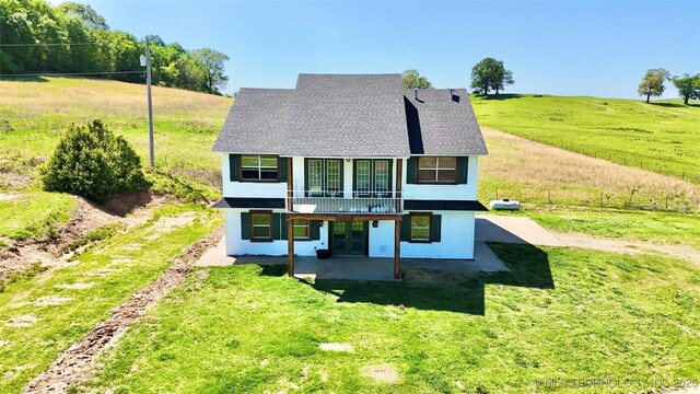 610 SW 7th Rd, Stigler, OK 74462 - rear view of house with a yard and a patio area