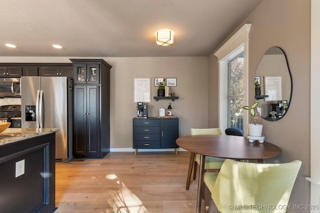 dining area with light hardwood / wood-style flooring