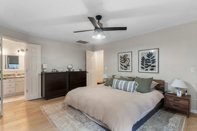 bedroom featuring connected bathroom, crown molding, ceiling fan, and light wood-type flooring