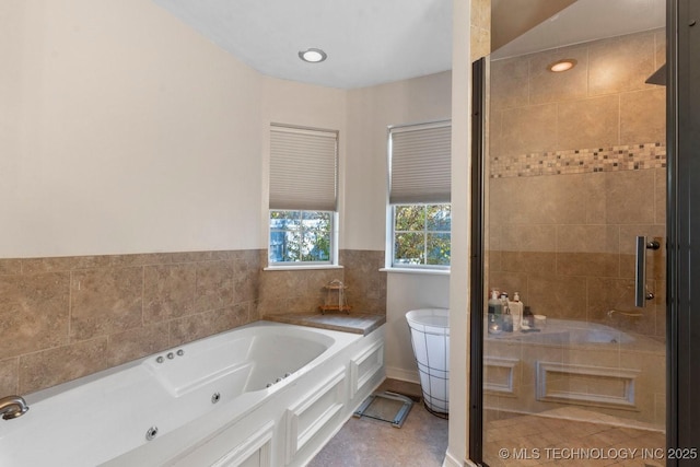 bathroom featuring separate shower and tub and tile patterned flooring