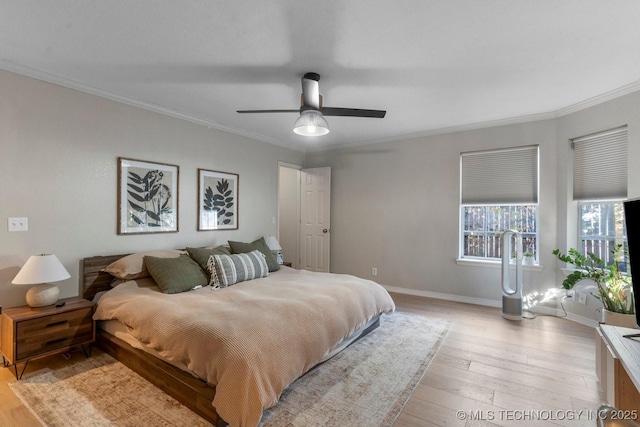 bedroom featuring ornamental molding, ceiling fan, and light hardwood / wood-style floors