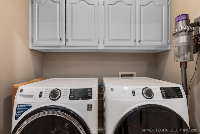 laundry area with cabinets and washer and dryer