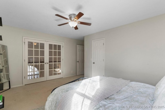 carpeted bedroom with french doors and ceiling fan