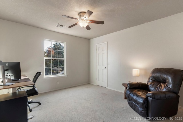 office with ceiling fan, light colored carpet, and a textured ceiling