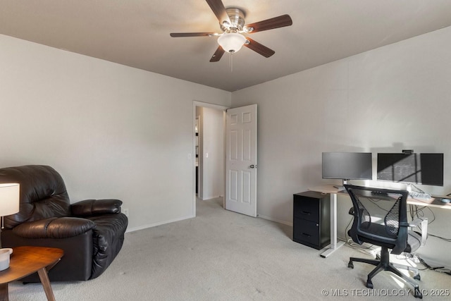 carpeted office space with ceiling fan