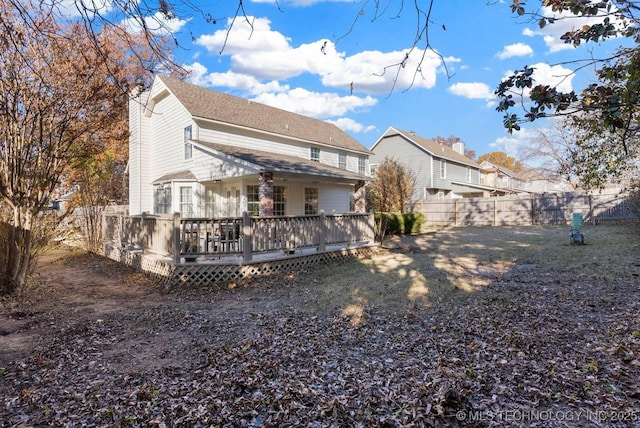 rear view of property featuring a deck