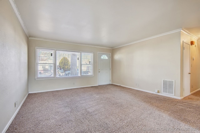 unfurnished room with ornamental molding and carpet flooring