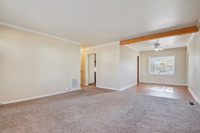 carpeted spare room featuring ornamental molding and ceiling fan