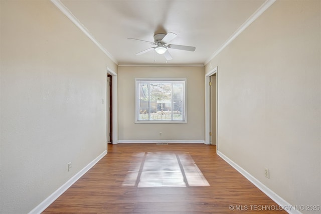 interior space featuring hardwood / wood-style flooring, ornamental molding, and ceiling fan