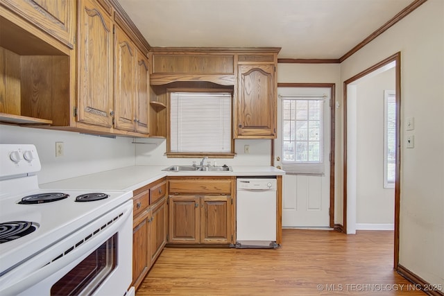 kitchen with white appliances, ornamental molding, sink, and light wood-type flooring