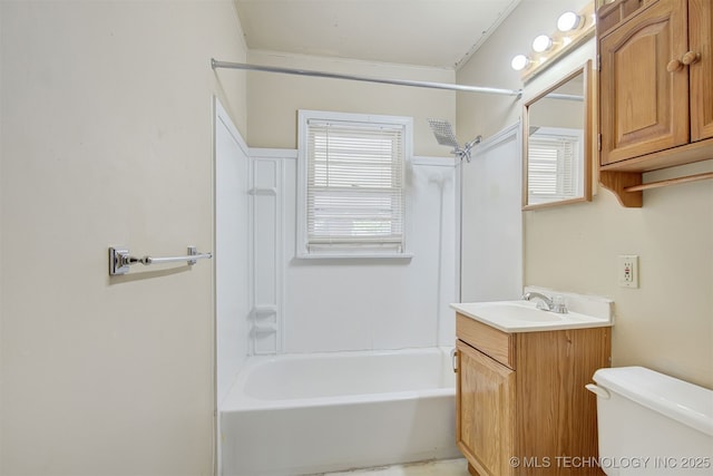 full bathroom featuring toilet, a healthy amount of sunlight, shower / washtub combination, and vanity