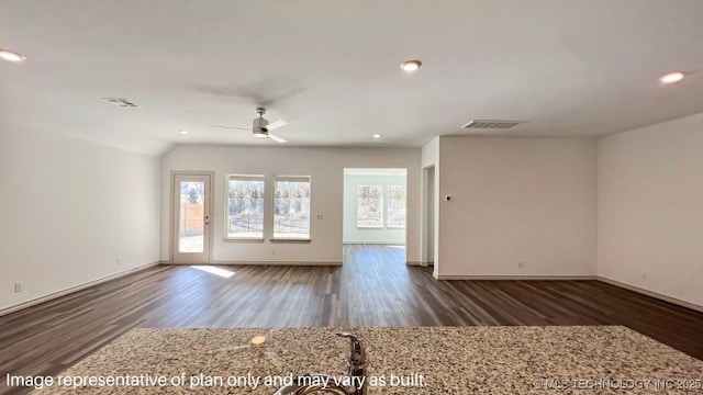 unfurnished room featuring vaulted ceiling, dark hardwood / wood-style floors, and ceiling fan