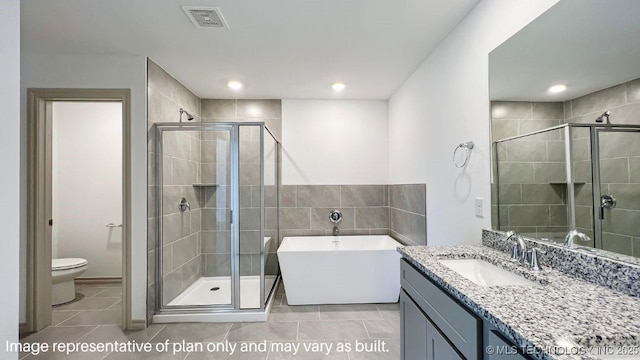 full bathroom with tile patterned floors, toilet, independent shower and bath, and vanity