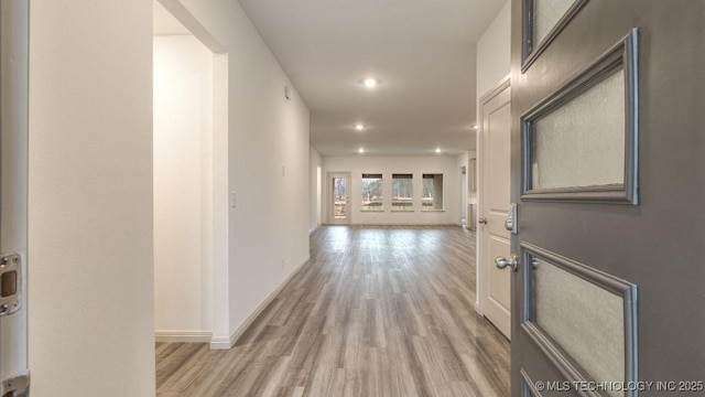 hallway with wood-type flooring