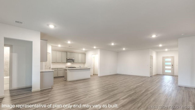 unfurnished living room with light hardwood / wood-style flooring