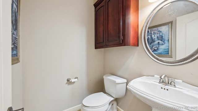 bathroom with toilet and sink