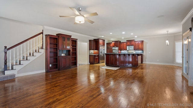 living room with dark wood-type flooring, ceiling fan, and crown molding