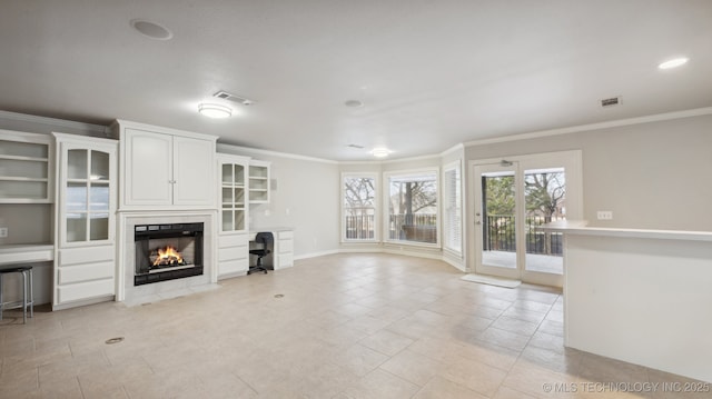 unfurnished living room with crown molding