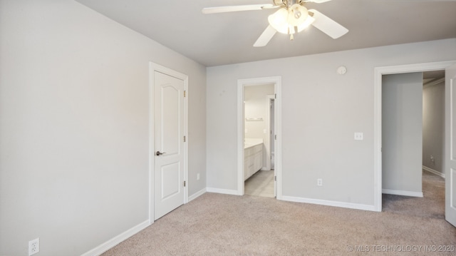 unfurnished bedroom with light carpet, connected bathroom, and ceiling fan