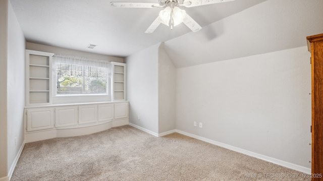 bonus room featuring ceiling fan, vaulted ceiling, and light carpet