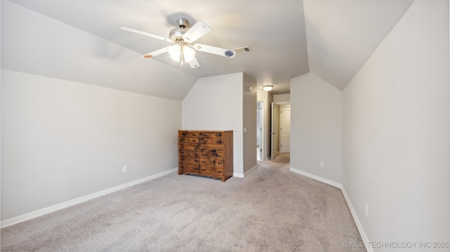 bonus room featuring vaulted ceiling, light carpet, and ceiling fan