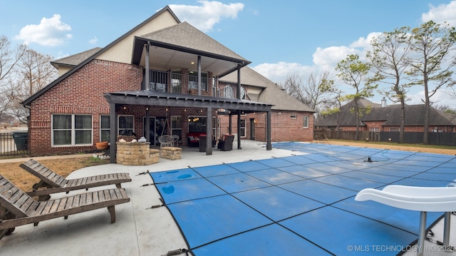 exterior space with a fire pit, ceiling fan, and a patio area