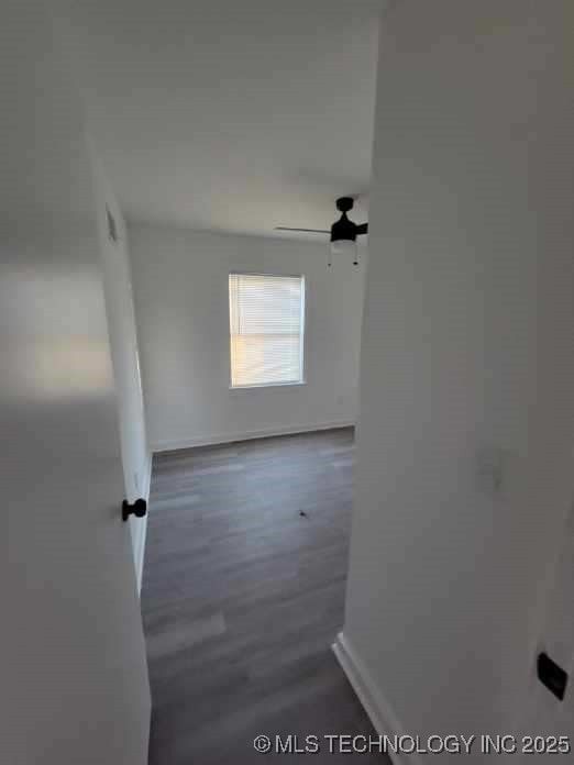 unfurnished room with ceiling fan