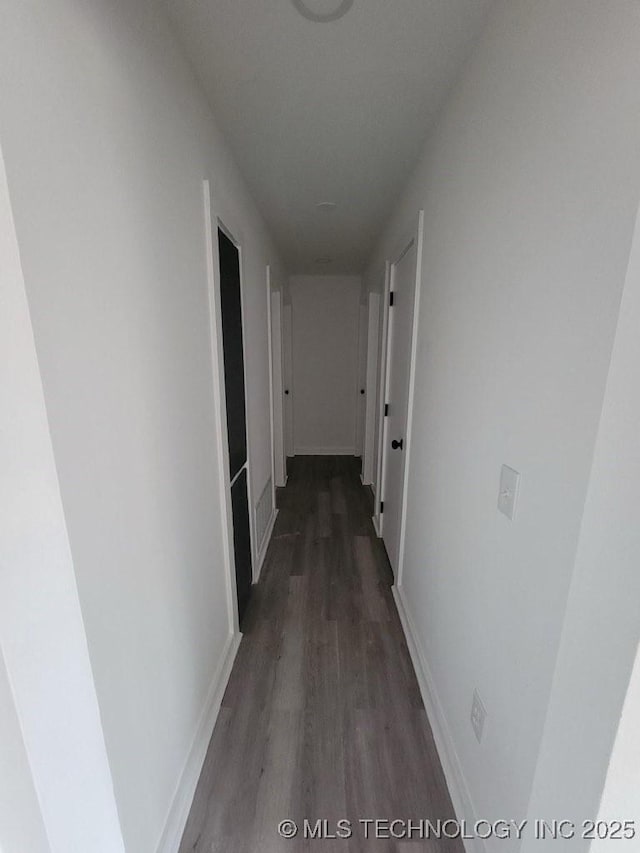 hallway featuring dark hardwood / wood-style floors