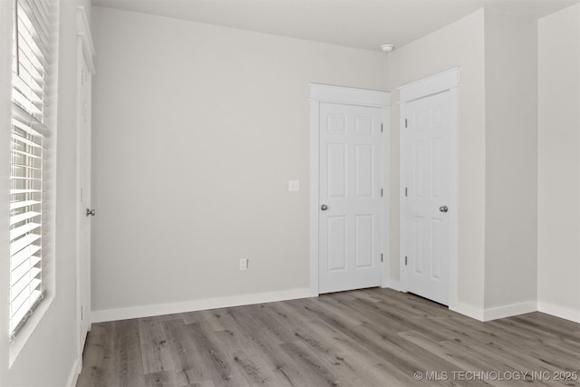 unfurnished bedroom featuring wood-type flooring