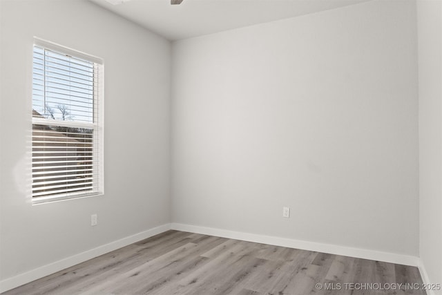 spare room with light hardwood / wood-style floors