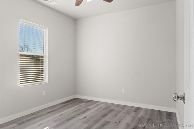 empty room featuring ceiling fan and light wood-type flooring