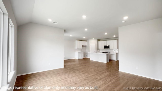 unfurnished living room featuring light hardwood / wood-style floors