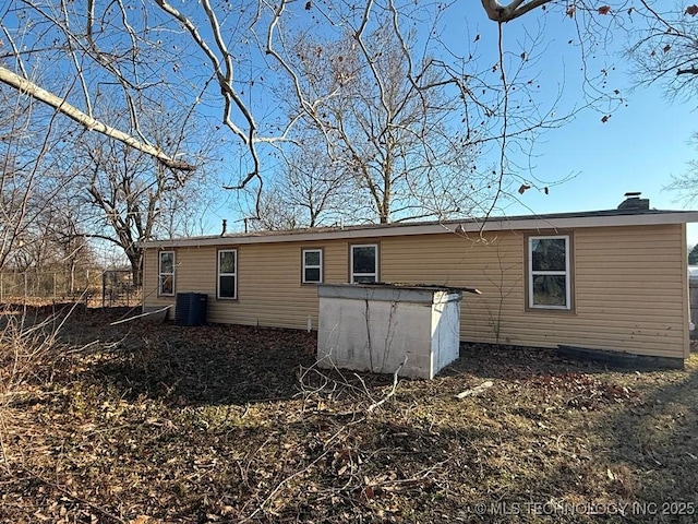 back of property with central air condition unit