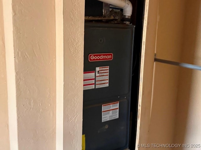 utility room with heating unit