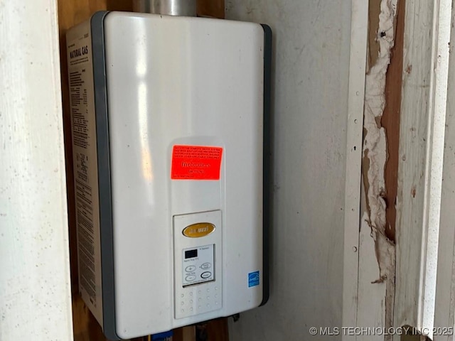 utility room featuring water heater