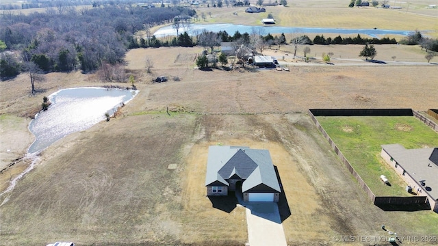 drone / aerial view with a rural view and a water view