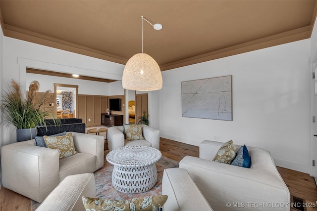 living room with hardwood / wood-style flooring and beamed ceiling