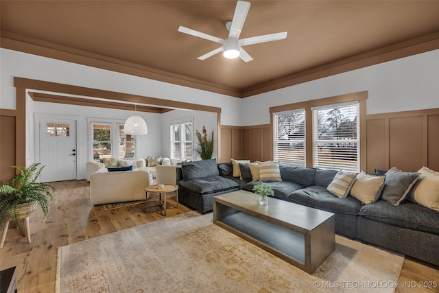 304 E Dallas St, Broken Arrow, OK 74012 - living area featuring a decorative wall, ceiling fan, wood finished floors, and a wainscoted wall